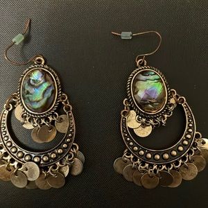 Earrings, translucent stone in the center.